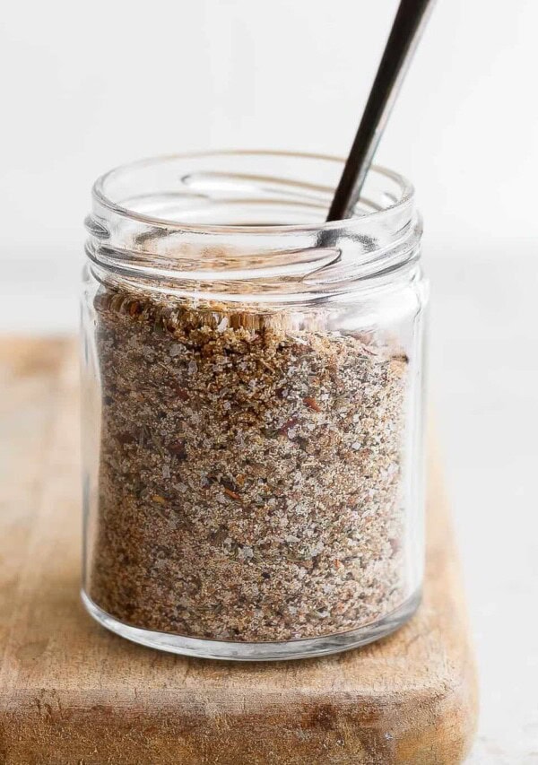 a glass jar with a spoon inside of it.