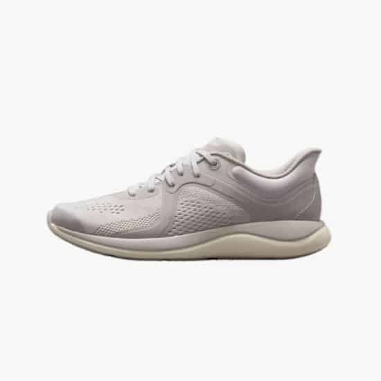 A light grey running shoe with a white sole.