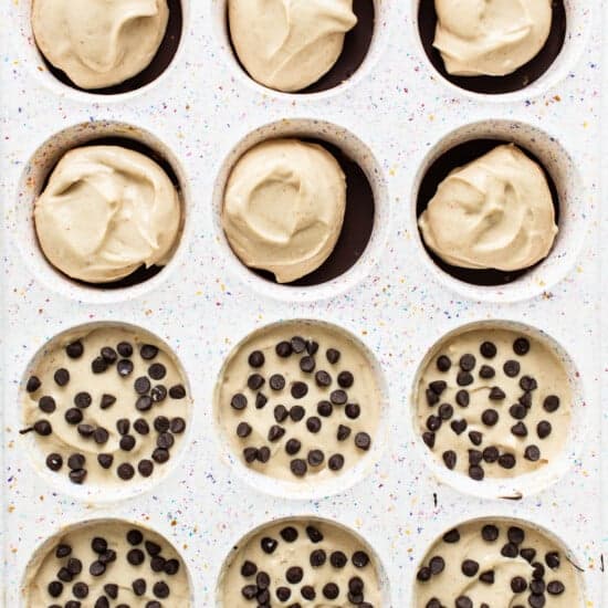 Chocolate chip cookie cups in a baking pan.