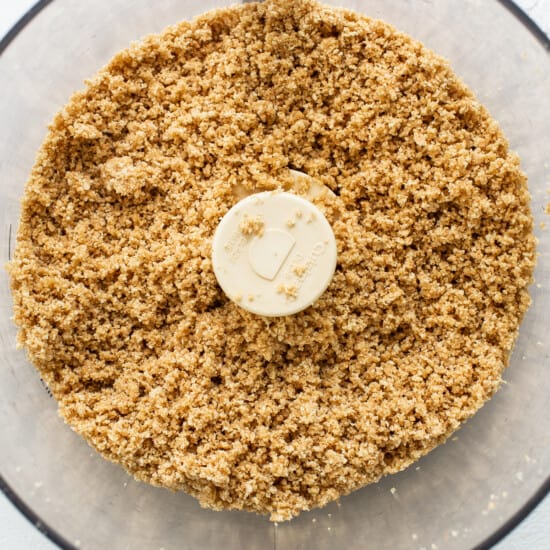 A food processor filled with granola.