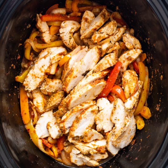 Chicken and peppers in a slow cooker.