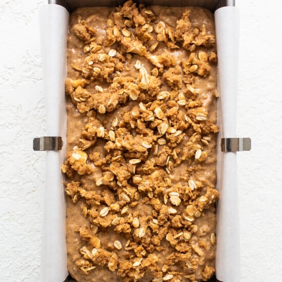 A baking pan filled with oats and granola.