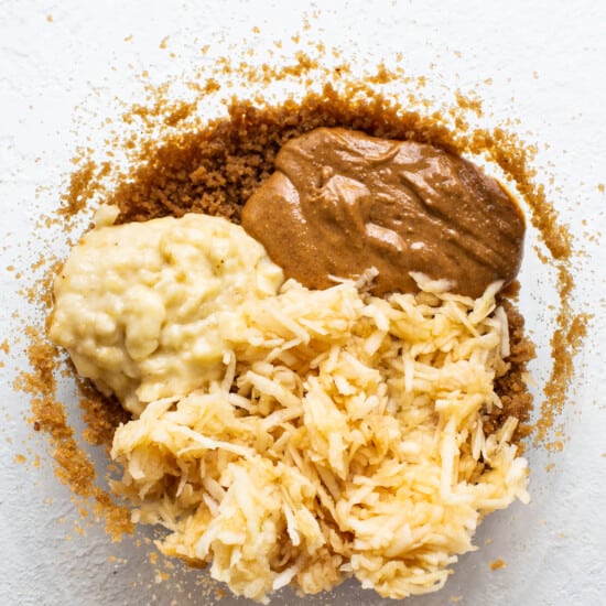 A bowl of ingredients for a peanut butter cookie.