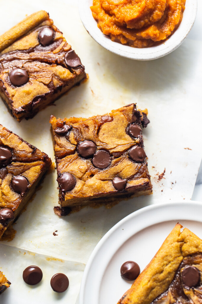 C،colate chip cookie bars on a white plate.