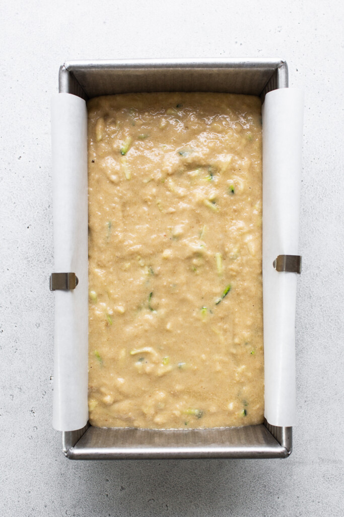 a metal pan filled with food on top of a table.