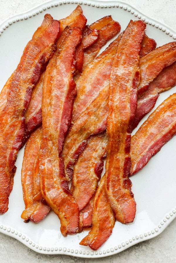 bacon on a plate on a table.
