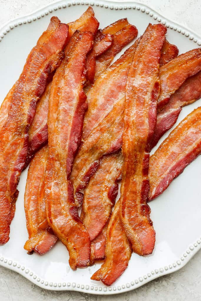 bacon on a plate on a table.
