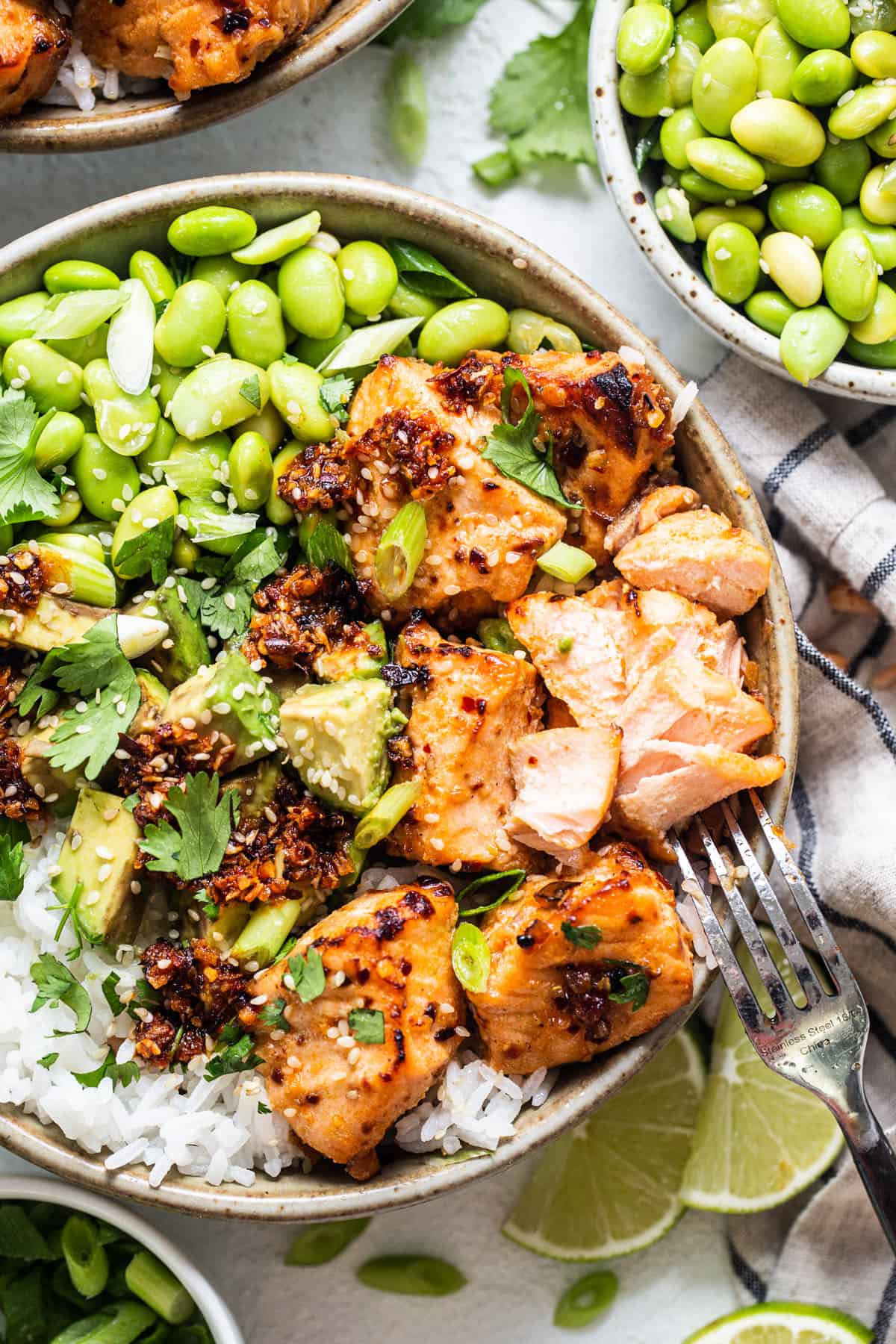 a bowl filled with chicken, peas, and rice.