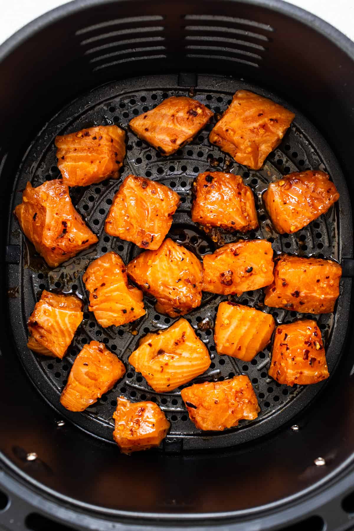 the food is being cooked in the air fryer.