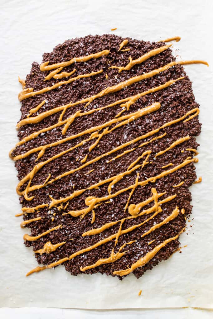 a piece of chocolate cake with caramel drizzle on top.