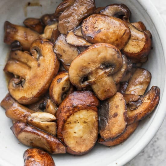 roasted mushrooms in a white bowl.