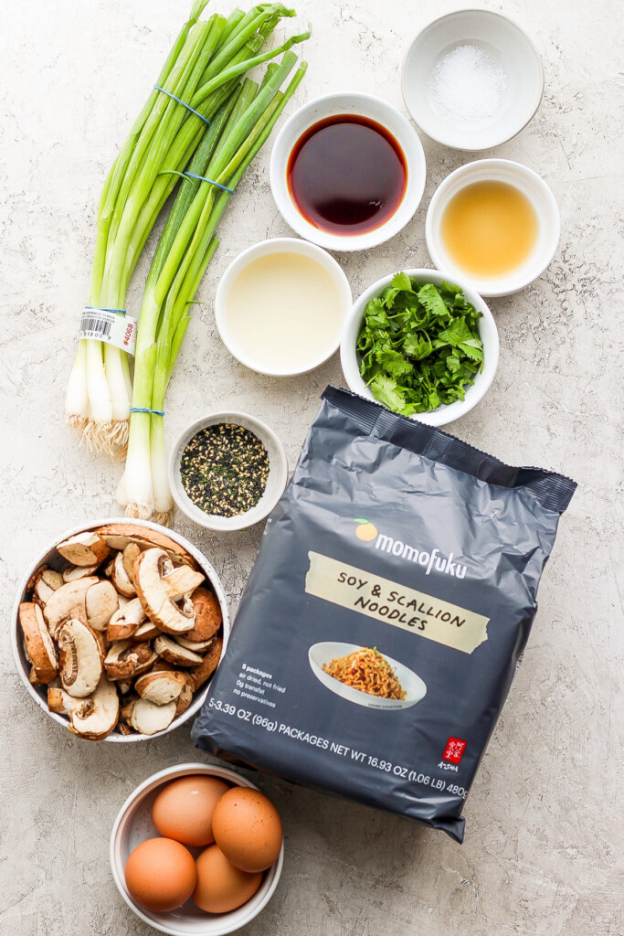 the ingredients for asian fried rice are laid out on a table.