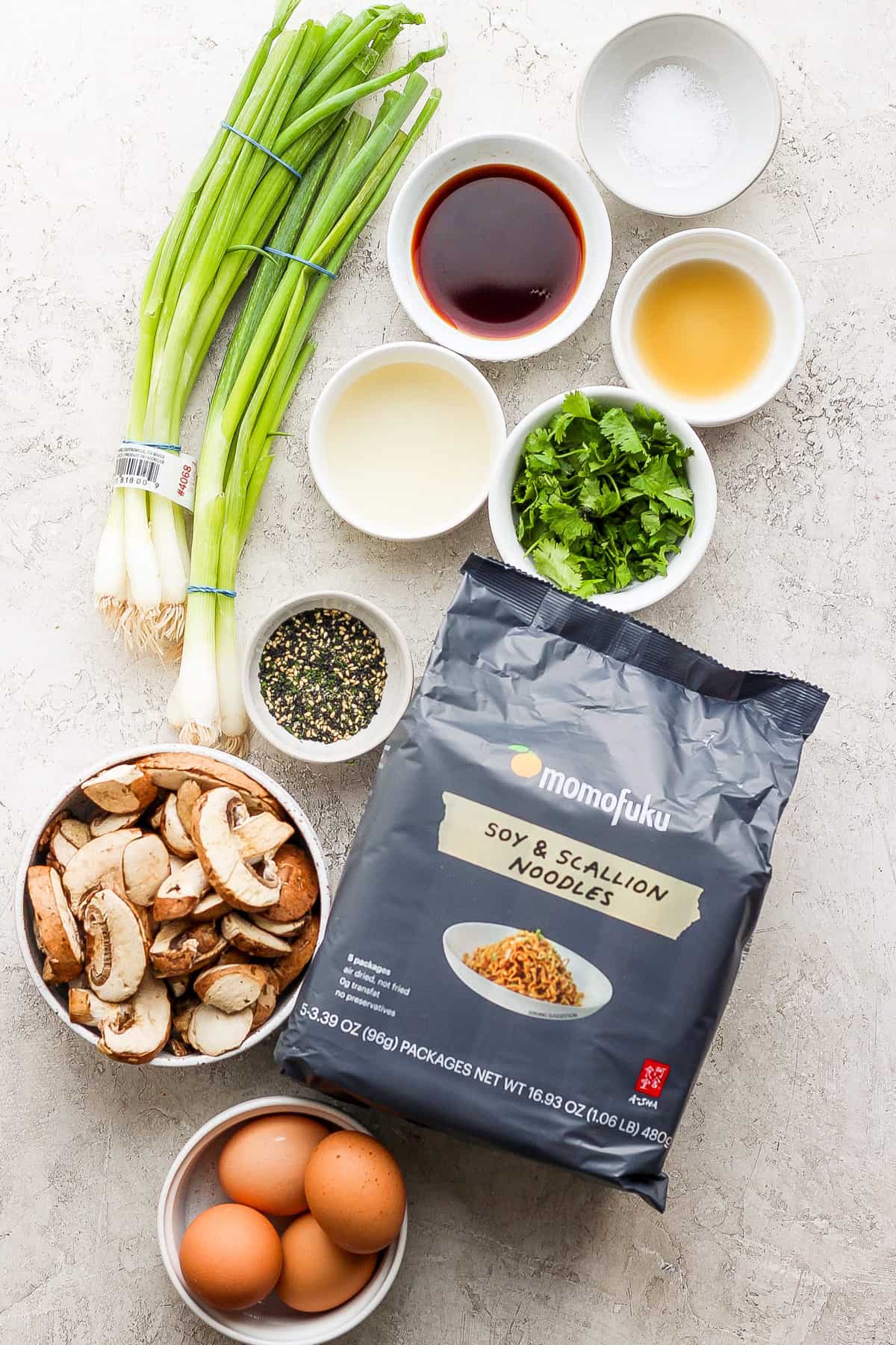 the ingredients for asian fried rice are laid out on a table.