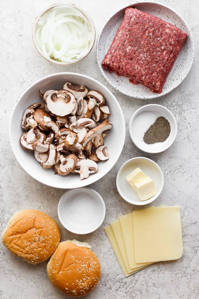 the ingredients for a hamburger with mushrooms and cheese.
