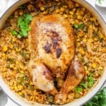 chicken with rice and corn in a skillet.