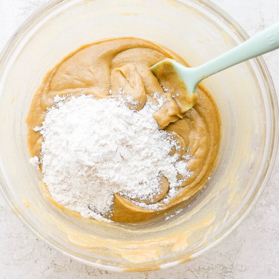 a bowl of peanut butter and powdered sugar.