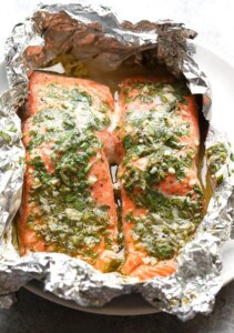 Grilled salmon in foil on a plate.