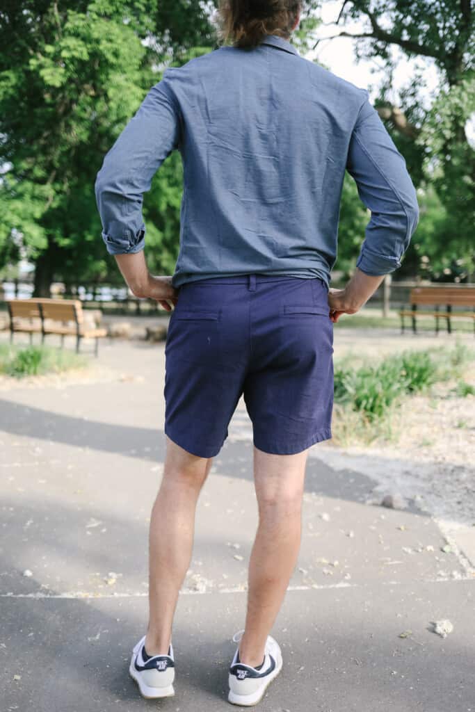 a man in a blue shirt and blue shorts.