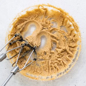 peanut butter in a bowl with a whisk.