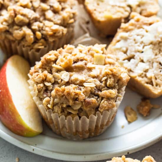 apple granola ،ins on a white plate.