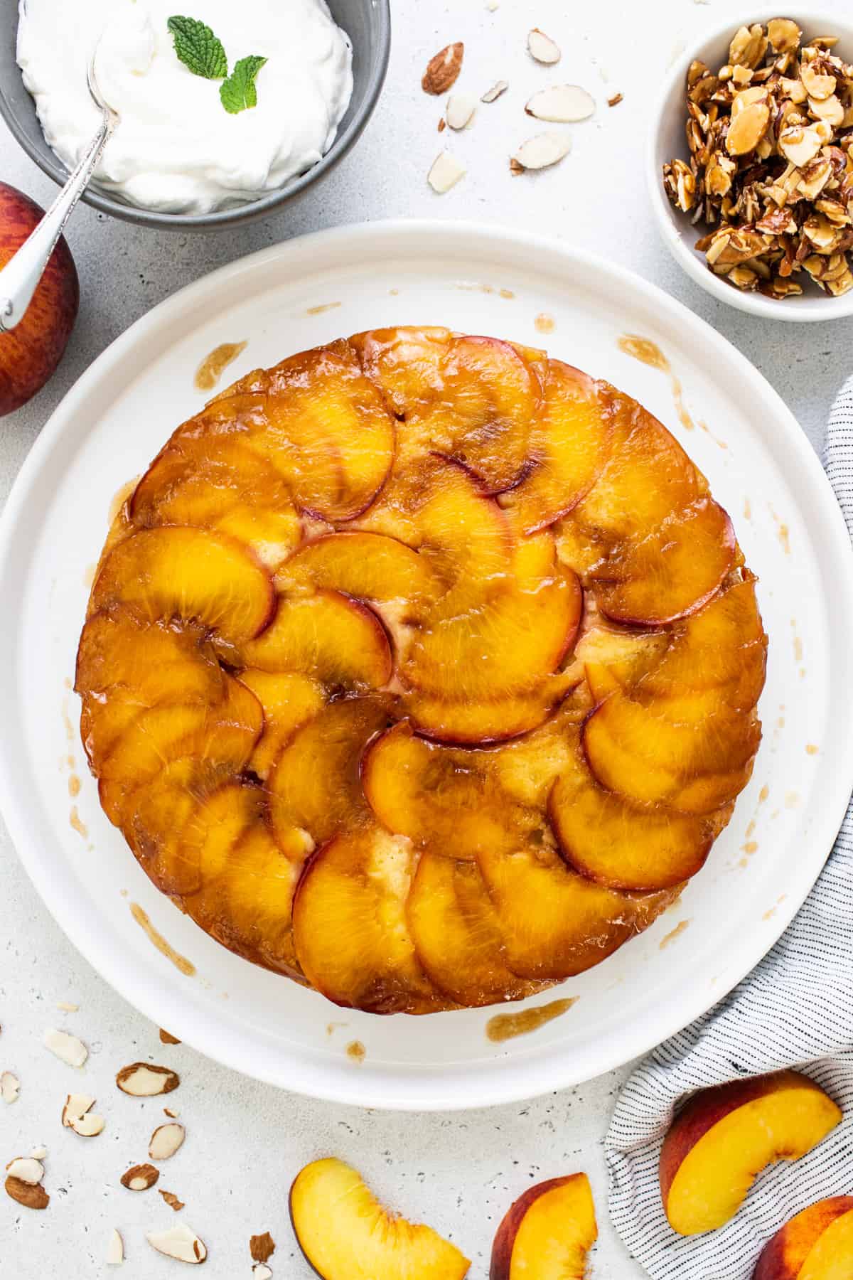 peach upside down cake on a white plate.