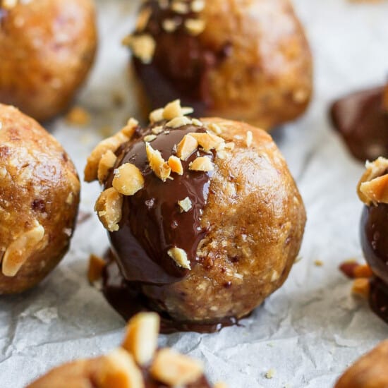 a plate of chocolate covered peanut butter balls.