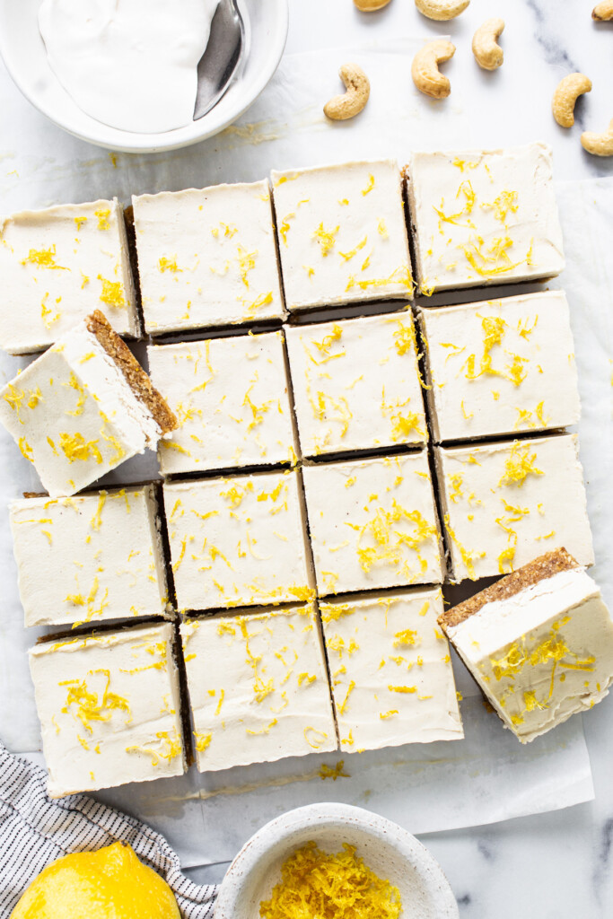 lemon bars with cashew cream and cashew nuts.