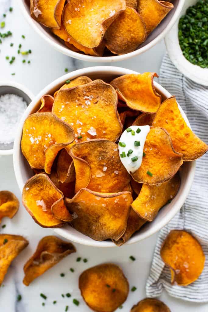 Sweet potato chips with sour cream and chives.