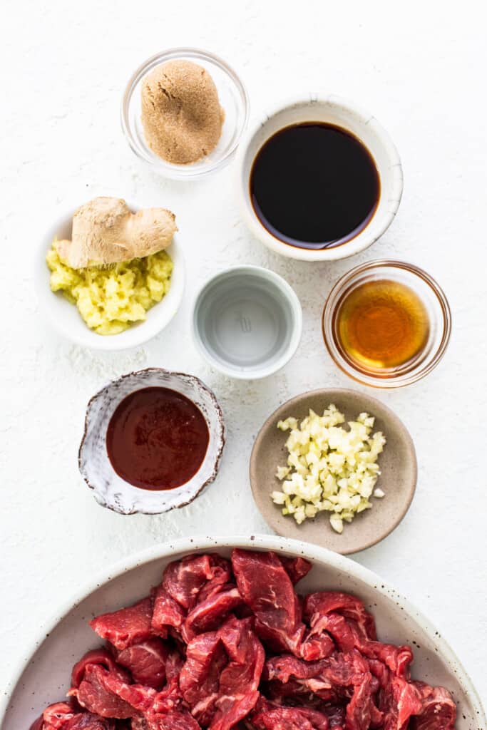 Ingredients for asian beef stew on a white background.