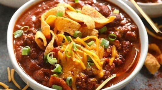Chili in a bowl with tortilla chips.
