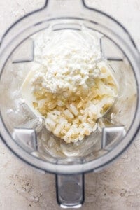 A food processor filled with ingredients.