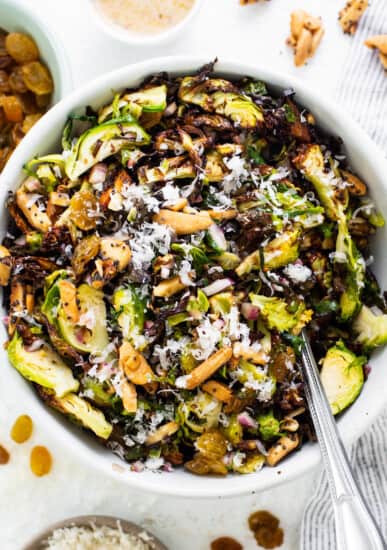 Brussels sprout salad in a white bowl.