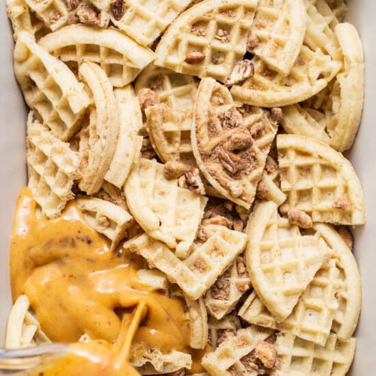 Waffles in a white baking dish with sauce.