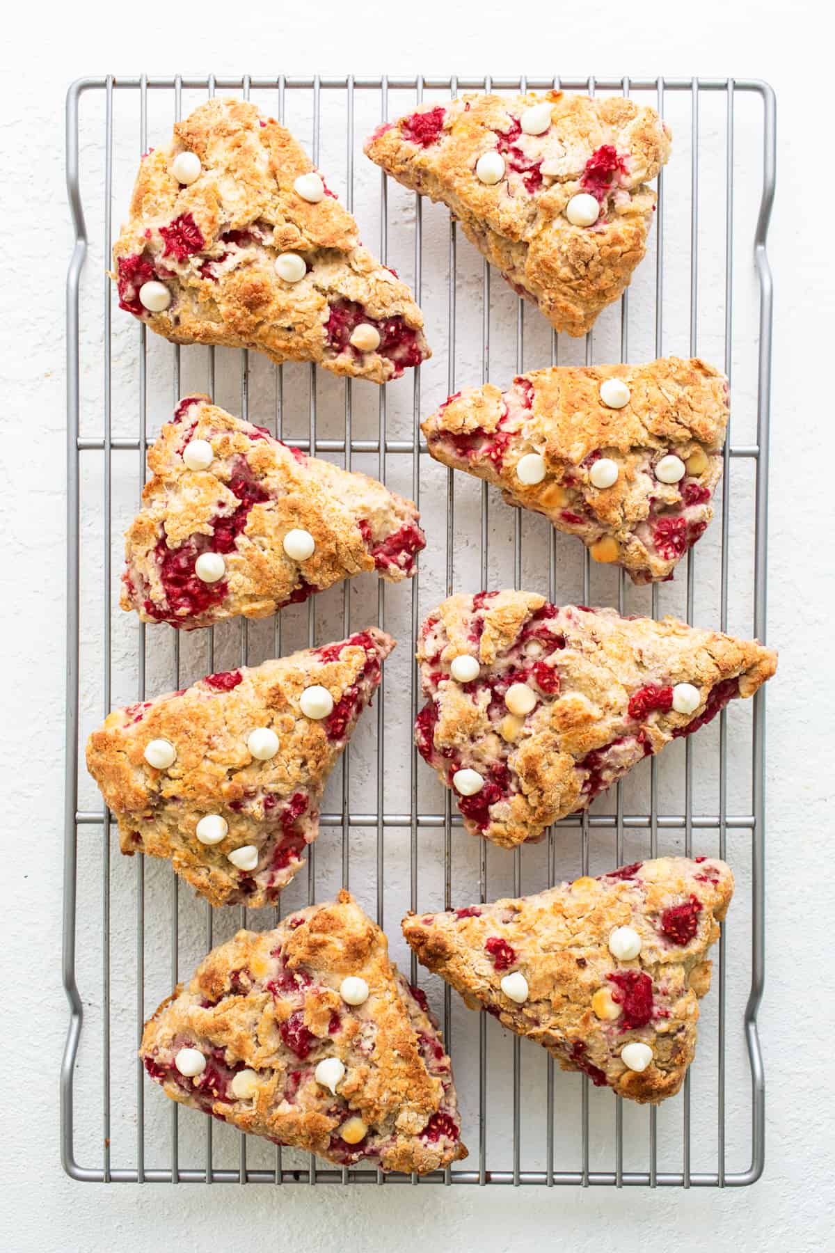 Cranberry scones on a cooling rack.