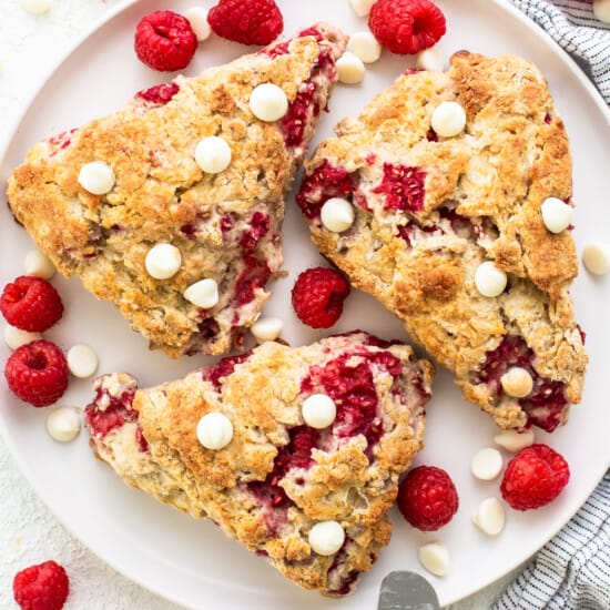 Raspberry and white chocolate bars on a plate.