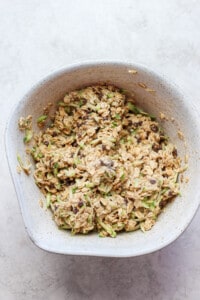 A bowl full of oats in a white bowl.