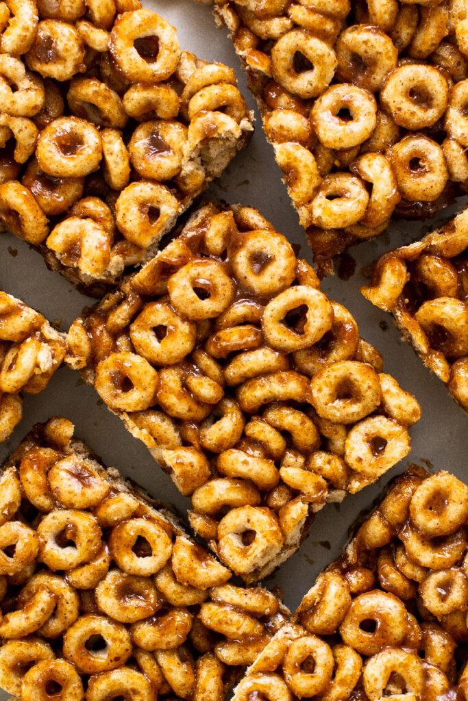 Cereal krispy bars are stacked on top of each other.