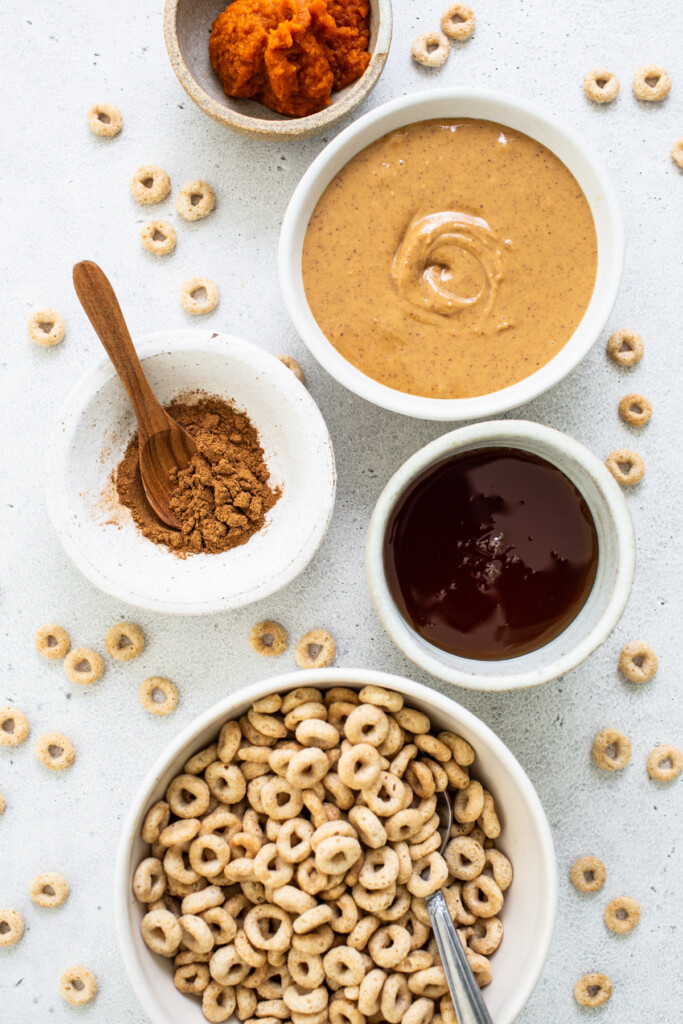 A bowl of cereal, a bowl of peanut ،er, a bowl of oatmeal, and a bowl of granola.