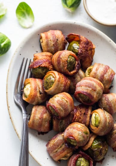 Bacon wrapped brussels sprouts on a plate.