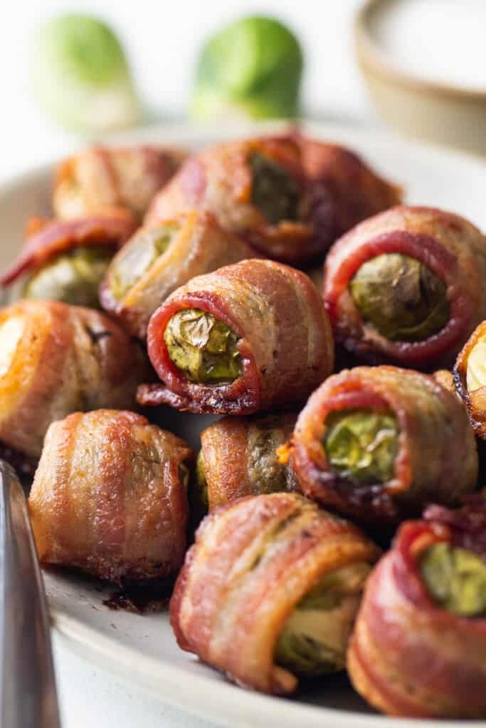 Bacon wrapped brussel sprouts on a plate.