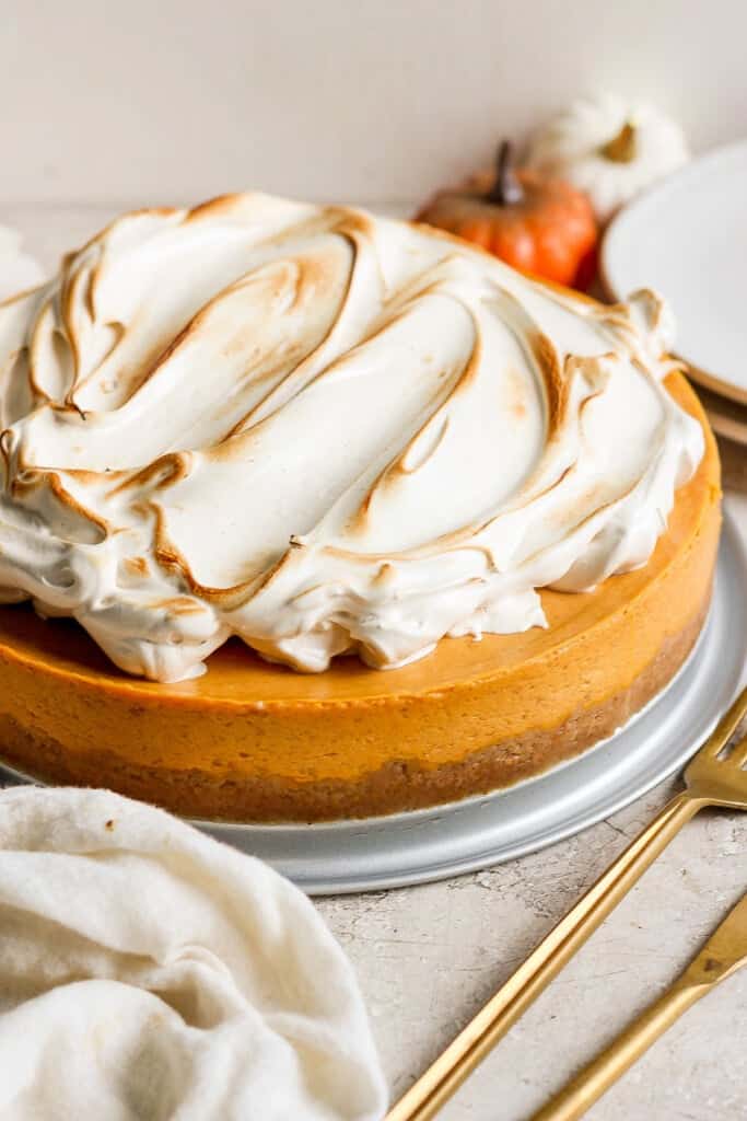 A pumpkin cheesecake with meringue on top.