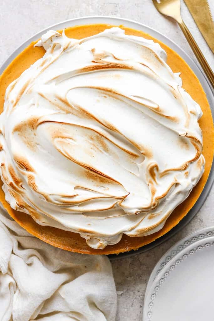 A pie with meringue topping on a plate.