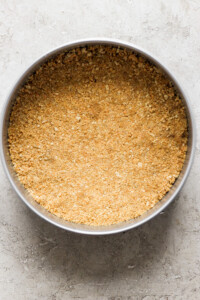 A pie crust in a bowl on a table.