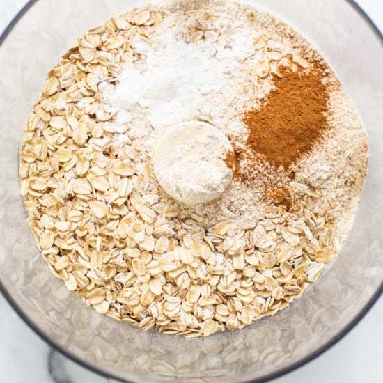 Oats, cinnamon, and other ingredients in a mixing bowl.