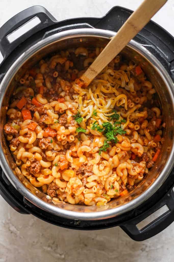 A pot of pasta and meat in an instant pot.