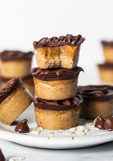 Peanut butter cups stacked on a plate.