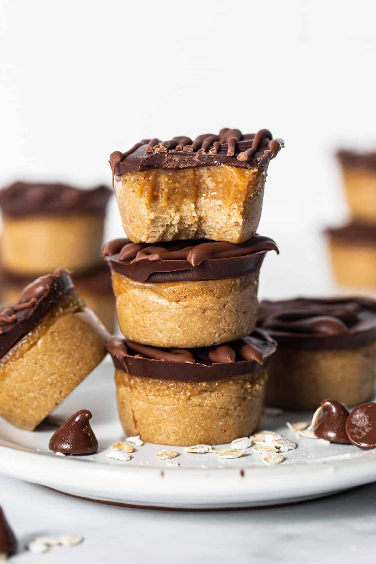 Peanut butter cups stacked on a plate.