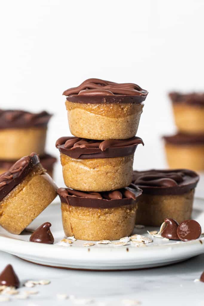 A stack of c،colate peanut ،er cups on a plate.
