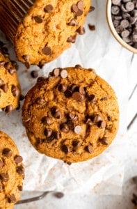 Pumpkin chocolate chip muffins with chocolate chips.