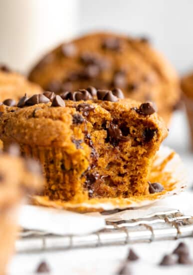 Pumpkin chocolate chip muffins on a cooling rack.